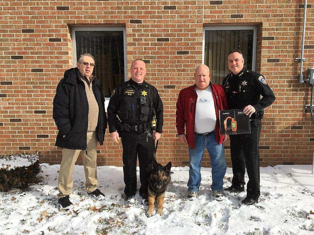 From left:  Retired Trooper Bernie Pitass, Deputy Tim Pence, K9 Nichols, Donor Larry Speiser and Sheriff Tim Whitcomb