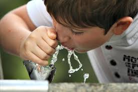 Boy at drinking fountain