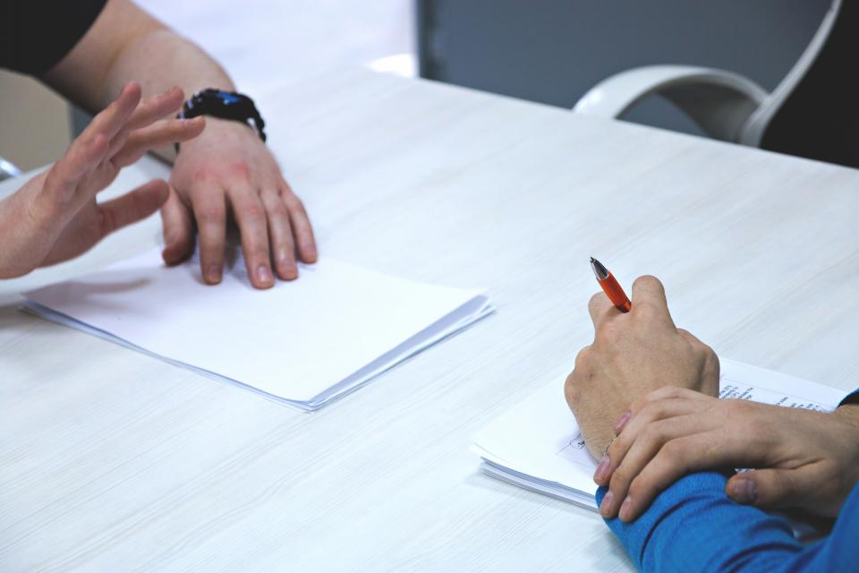 Image of hands working on paperwork. ID 114069615 © Nataly Mayak | Dreamstime.com